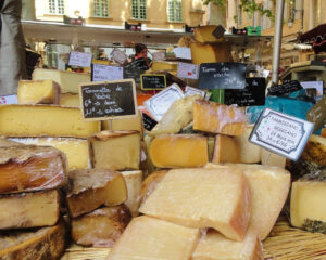 View of a cheese market stall in Aix en Provence featuring very appetising cheeses from France